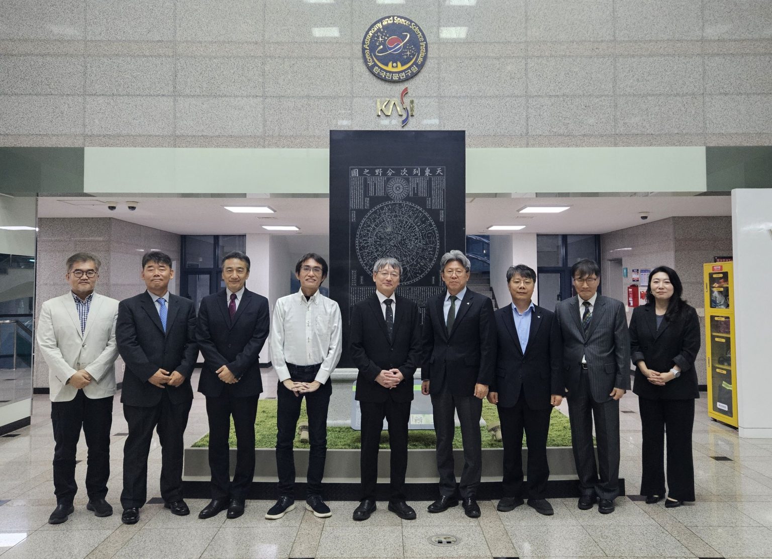 Group photo of NAOJ and KASI officials at the MOU amendment signing ceremony